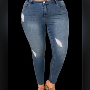 Torrid Women's Straight Leg Distressed Blue Jeans stock photo slightly different